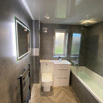 panelled bathroom with herringbone floor